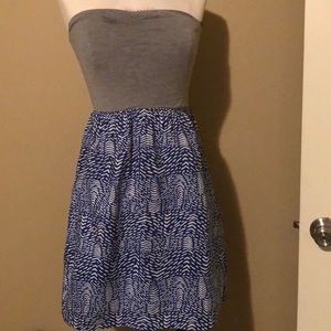 Gray and blue strapless dress.